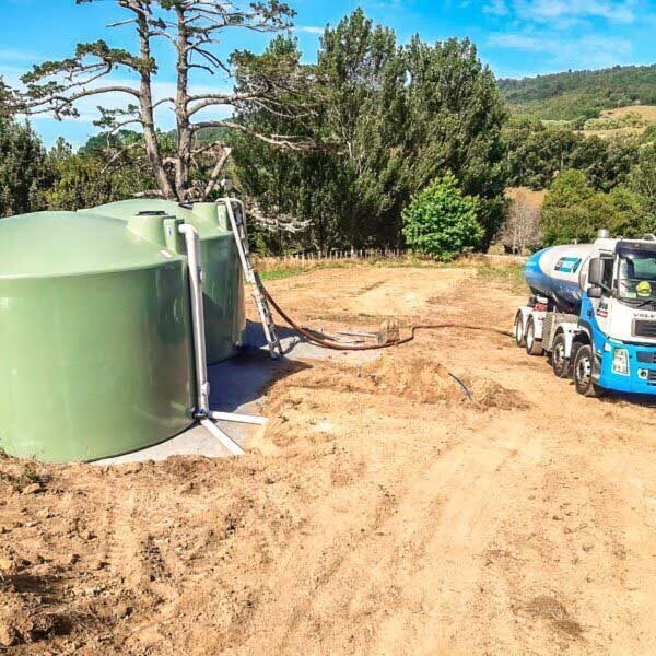 water tank installation in rural setting